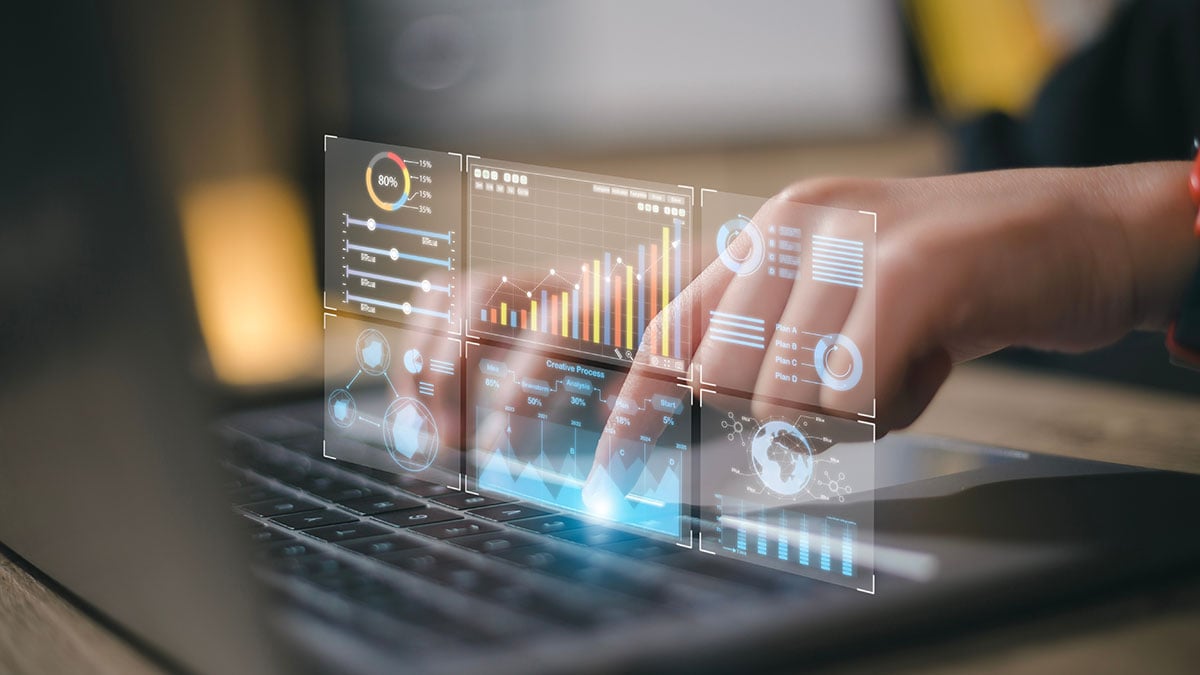 Data analyst reviewing a business analytics dashboard