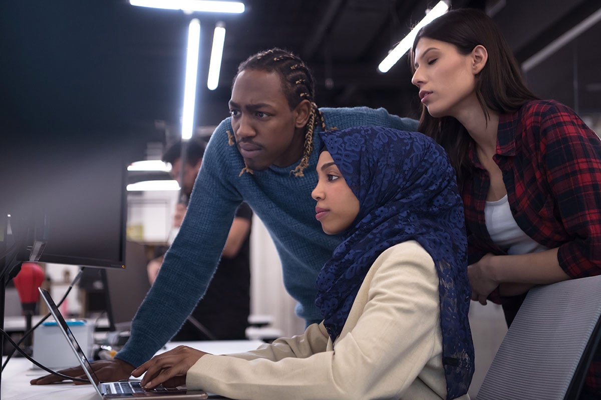 Software developers collaborating at their computers