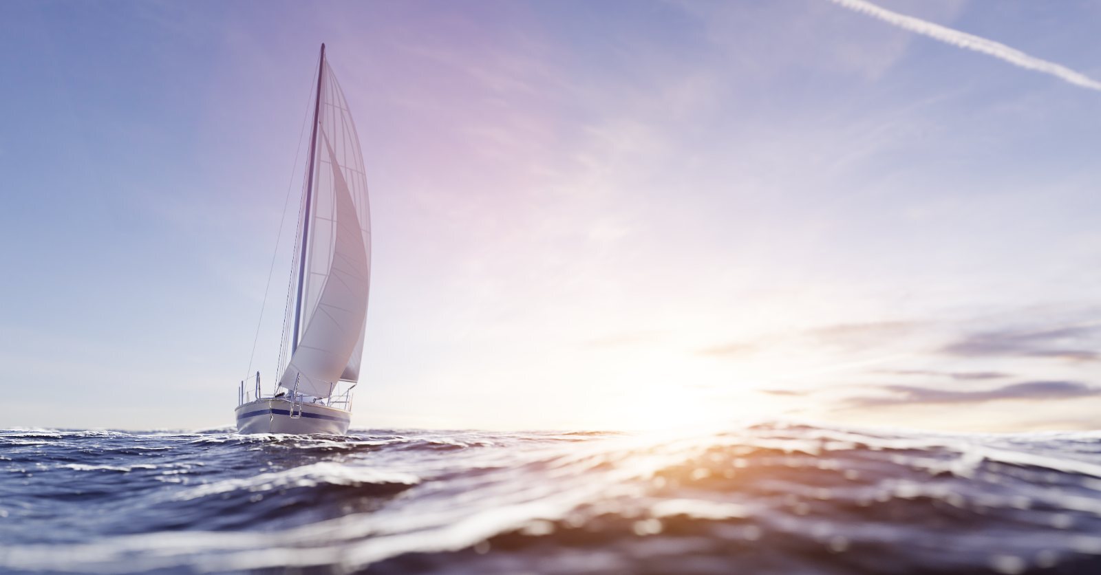 Sailboat under full sail on open water